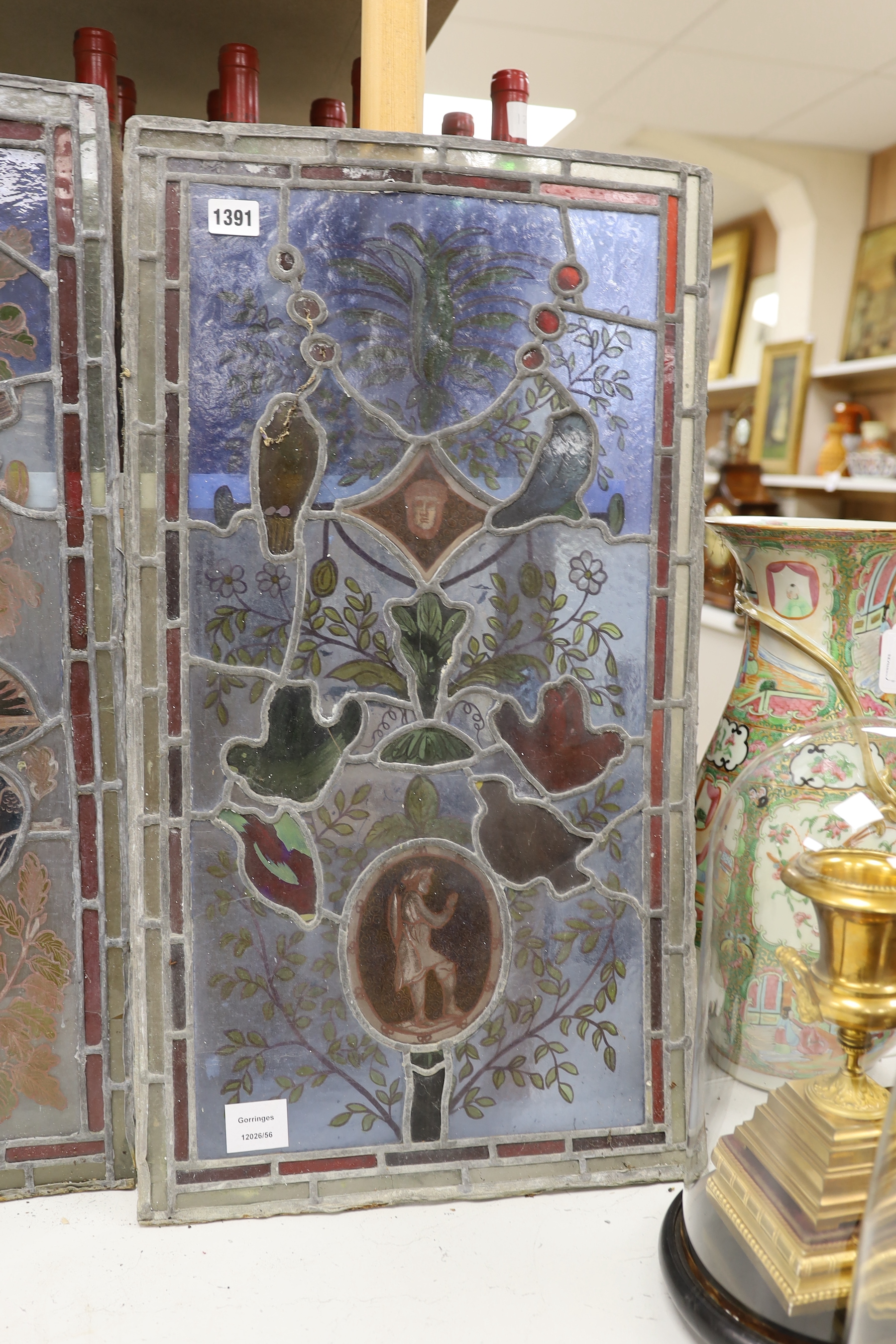 Three stained glass panels of birds and foliage, 71cm high, 39cm wide (a.f.)